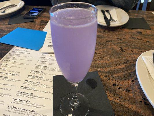 French '75 cocktail: gin, champagne, simple syrup, lemon juice (not sure what gives it the purple color)