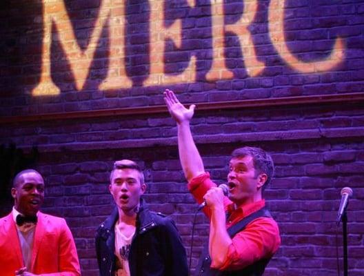 The cast of Cabaret at the Merc sings "Let's Go Fly a Kite" at the finale of a Disney concert, "Inside the Magic."