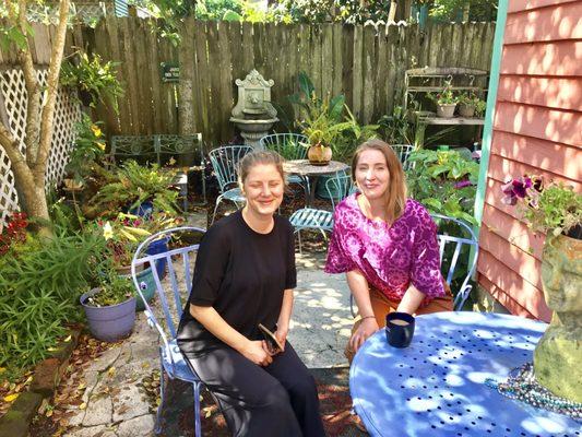 A Danish girl and a London girl enjoying the morning in the garden