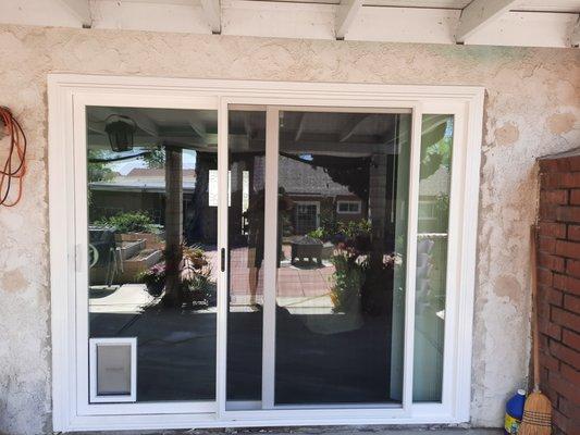 The outside of the sliding door with pet door that they did. So well insulated and the vinyl frame looks so good