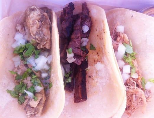 From left to right - chicken, steak and carnitas tacos