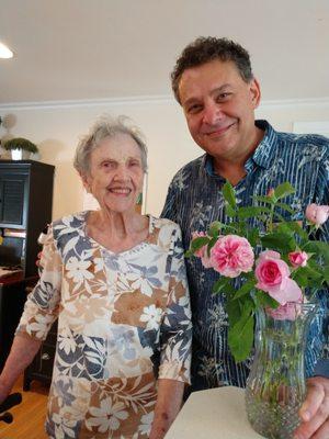 With one of my lovely clients, who just received roses from my garden