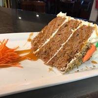 Carrot cake layer cake with cream cheese buttercream and spice walnut topping