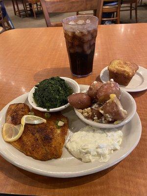 Tilapia, tartar sauce, spinach, potatoes, and Mexican cornbread.