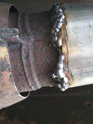 No penetration.  Just 1/8"-1/4" balls of weld rod. Arc welder can't generate enough amperage to melt steel. Part of sleeve not even "welded"