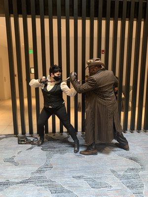 Steampunk Blade battling Victorian Catwoman.