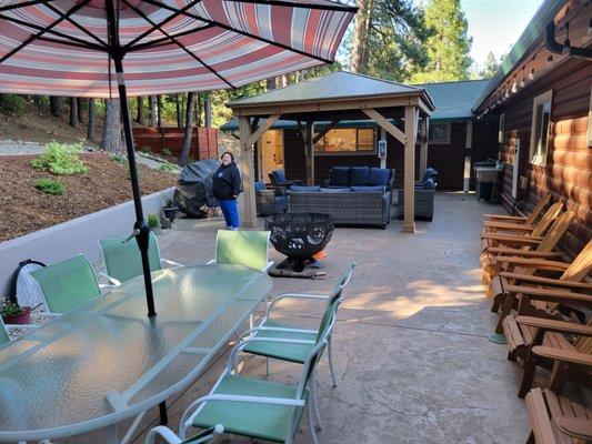 Fire pit, tables, patio furniture 2 gas BBQ grills, chairs and sink.  I think there was a laundry room but not sure if for Staff only