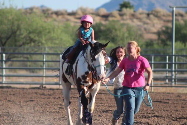 Rosalee and Sam bringing Liberty,3, on her way home at the Scottsdale Saddle Club Gymkhana on B.R.