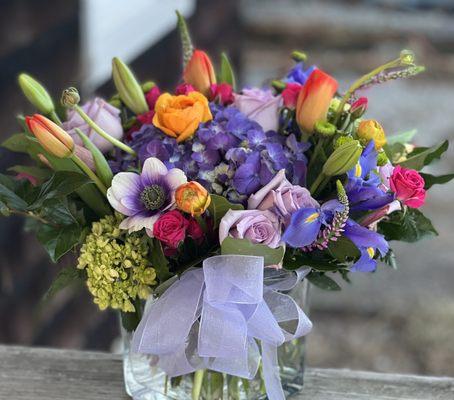 Shenanigans 

Purple & green hydrangea, tulips , ranunculus, ocean song roses