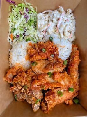 Spicy Sesame Chicken - Tri-Pepper rubbed thigh, fried and tipped with wing sauce, fried garlic, green onion, cilantro, Thai chilis