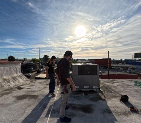 Alex and Jonny on one of our commercial clients roofs doing maintenance.