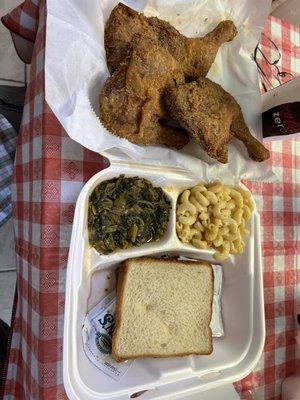 Fried chicken dinner with mac n cheese and greens.  Good flavor to all items.