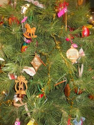 LOTS OF BEAUTIFUL HANDMADE CHRISTMAS ORNAMENTS ON ONE OF OUR FOUR TREES @ BOOT HILL COUNTRY GIFTS.