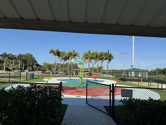 Splash pads looking from covered picnic area. Wish there was a changing stall or 2 by the splash pad.