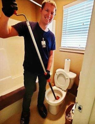 Our Owner, Andy, Unclogging a toilet