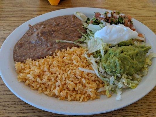 Refried beans, rice and the usual stuff to fill a tortilla besides the meats