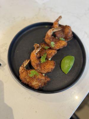 Coconut shrimp - not spicy at all; sweet, tangy, crunchy, with a touch of pleasant heat. 5/5