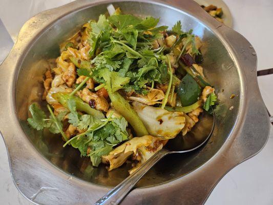 Spicy chicken in flaming pan