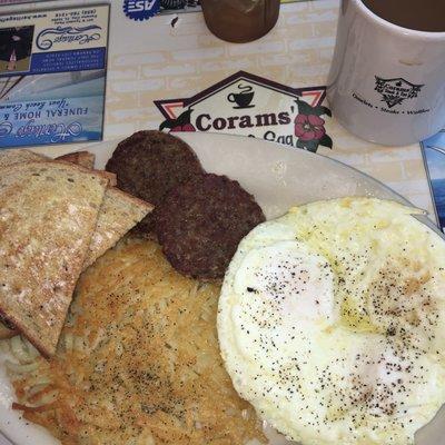 Over medium eggs with sausage and hash browns