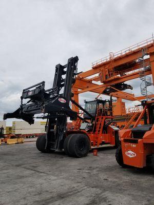 Inspection of large intermodal forklifts at rail yard.