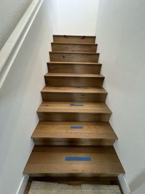 Stairs from the living room leading upstairs