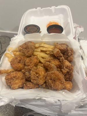 Fried shrimp and fries with lemon pepper seasoning