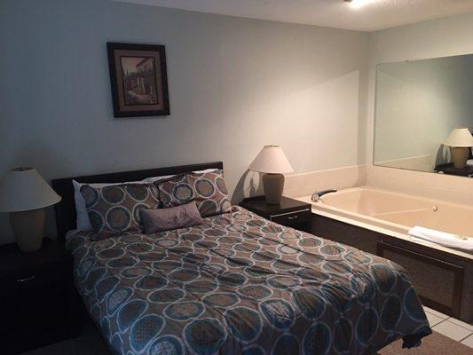 Bedroom with jacuzzi tub.