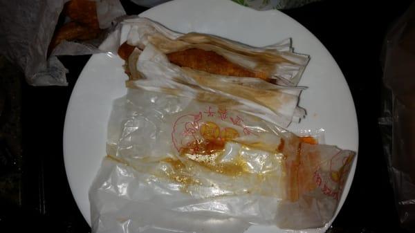 Said greasy egg roll and the four napkins. See the grease collected in their bag? Not happy.