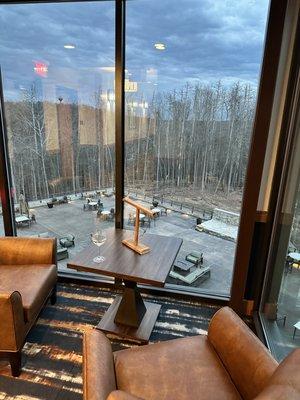 Small sitting area at the end of the hall looks out over a terrace