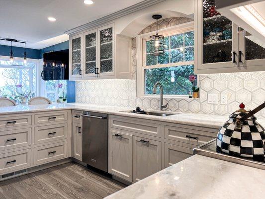 Custom built, white kitchen cabinets.