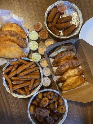 Assorted empanadas, plantains, yuca fries, croquettes