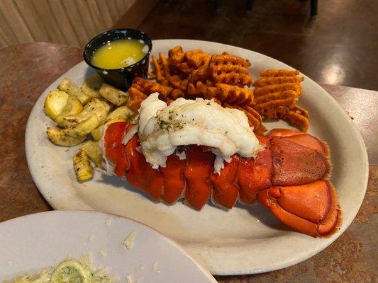 lobster tail with sweet potato waffle fries and garlic butter sauce