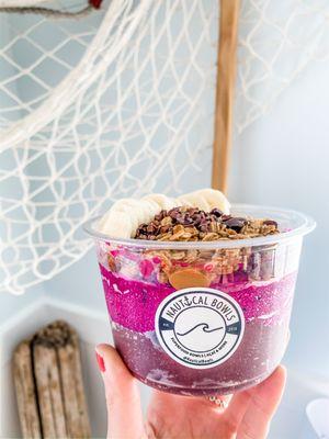 Meet the Nauti Bowl, one of our top selling Signature Bowls. Açaí, Pitaya, Granola, Banana, Peanut Butter, and Cacao Nibs.