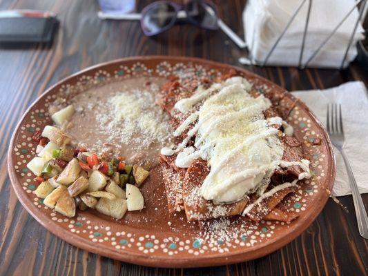 Chilaquiles with rice, beans an potatoes.