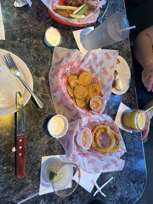 What we got was so yummy margaritas, fried pickles, onion, rings, burgers, and wings