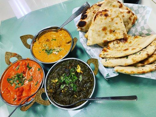 Butter chicken, lamb korma, saag paneer, and plain and garlic naan