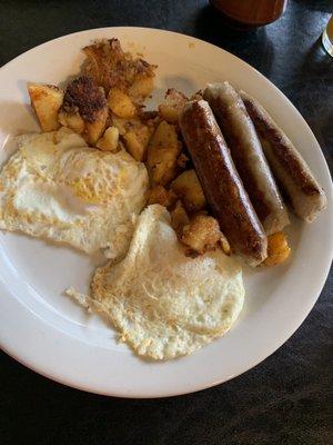 Hash browns , sausage and two eggs .