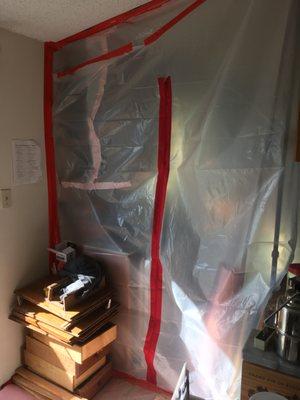 2. Fake "containment" that opened into our interior living space (dining area off the kitchen). There was no negative pressure containment.