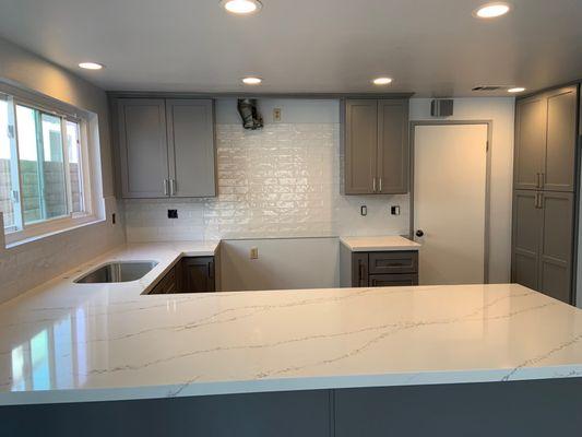 Quartz countertop and thick subway tile