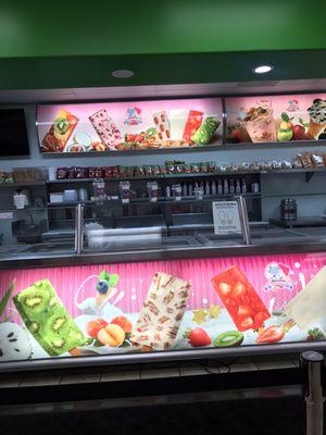 Counter with pics of ice creams