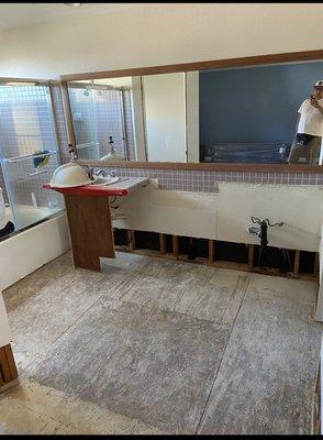 Master bathroom before the tub tile was removed