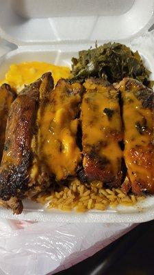 Ribs, mac & cheese peas and rice and collards.