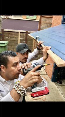 Our supervisors Sergio and Miguel collaborating on a rodent seal-up job.