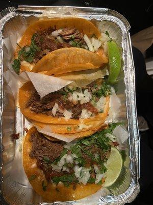 Birria tacos that come with beef broth soup to dip them in