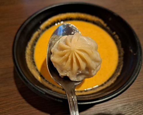 steamed lamb momo served with jhol