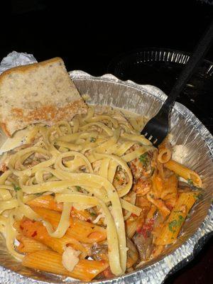 Split the fettuccine Alfredo and spicy penne pasta