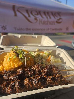 Beef skewers and coconut rice.