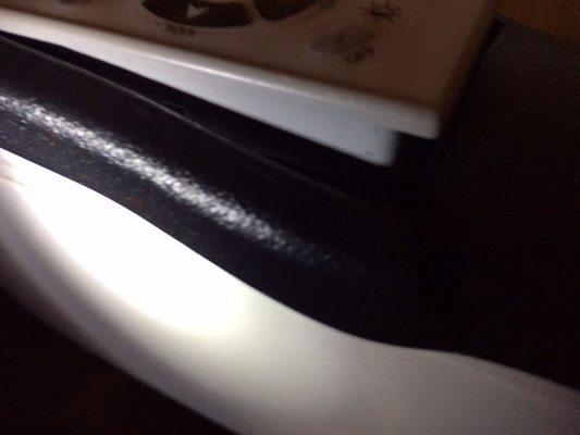 Broken cover on arm rest for tv control. Jet Blue airlines.