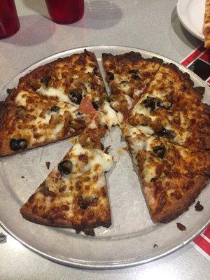 Gluten free crust only comes in small. Speciality pizza with pepperoni, sausage, mushrooms, and we added the black olives