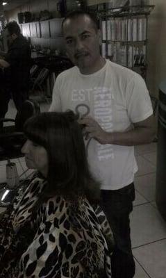 Hair by victor working whit a client